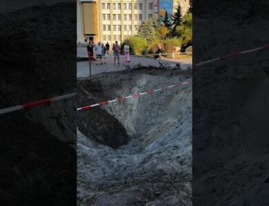 A toddler is learning to walk beside the crater left after Russia’s attack on Ukraine